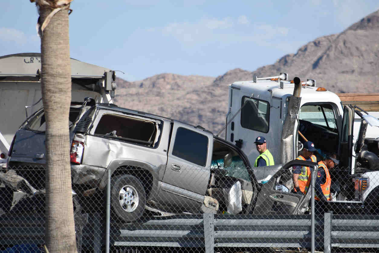 A severe crash on Utah's I-80 corridor, involving a damaged SUV and semi-truck, with emergency responders at the scene.
